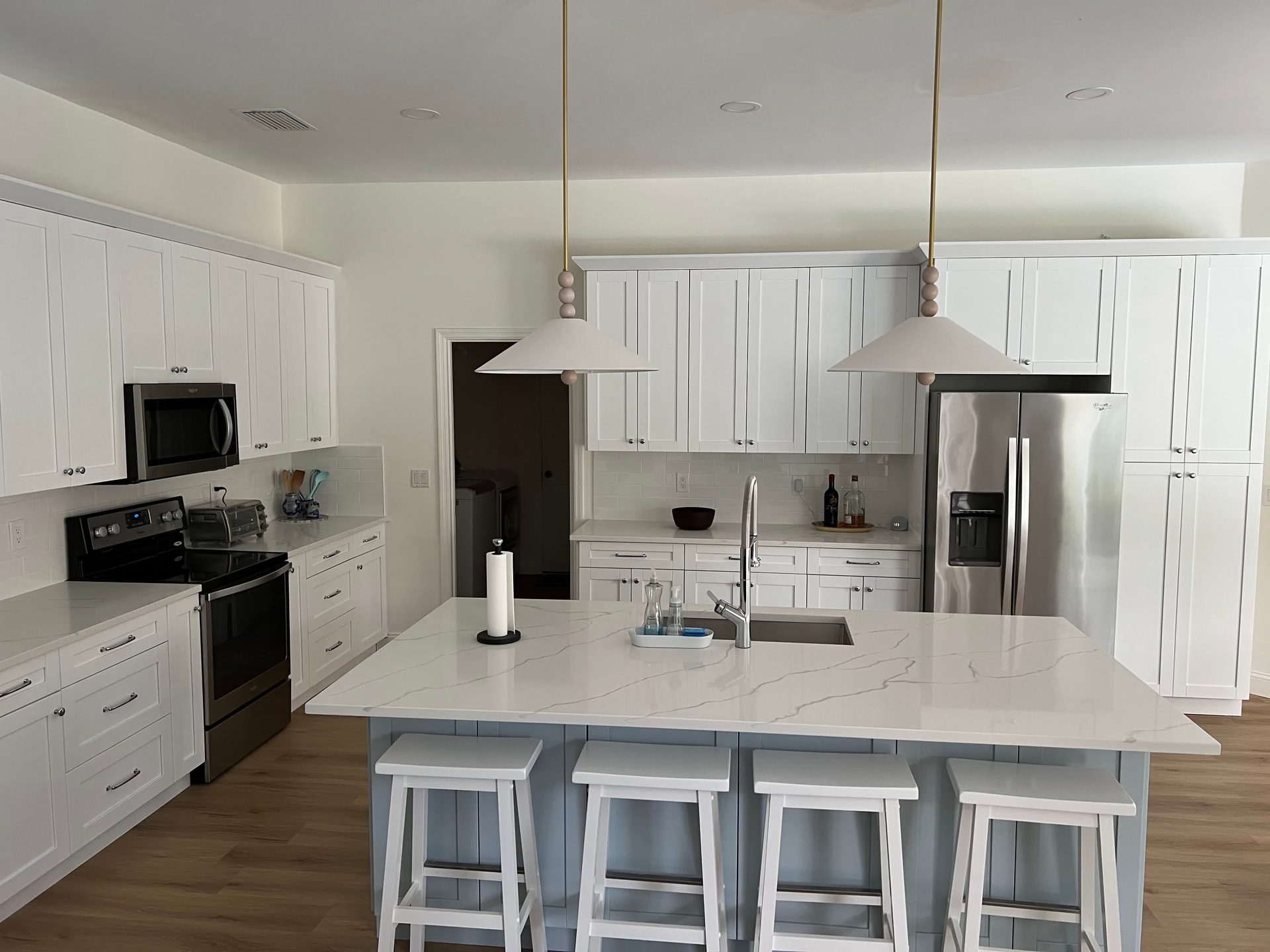 Remodeled kitchen with custom cabinetry and island by Urban Remodeling, Vero Beach