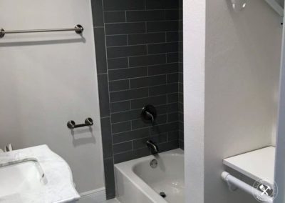 Remodeled Bathroom in Vero Beach, with white and gray tiles