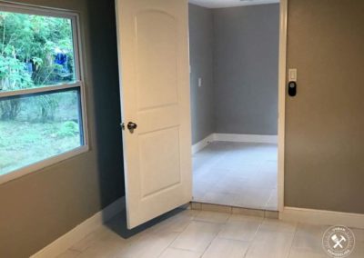 Remodeled Livingroom in Vero Beach, with white tiles and gray walls