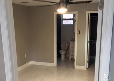 Remodeled Livingroom in Vero Beach, with white tiles and gray walls